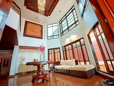 Luxurious living room with high ceilings and elegant chandelier