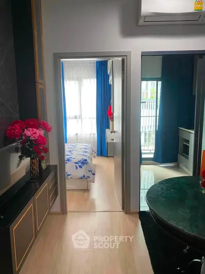 Modern apartment interior with elegant decor, featuring a cozy bedroom and stylish living area.