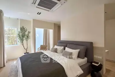 Luxurious modern bedroom with elegant decor and natural light