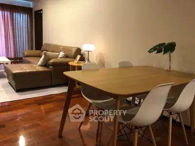Modern living room with stylish furniture and wooden flooring
