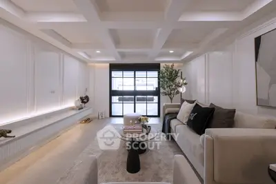 Elegant living room with modern decor and large window view