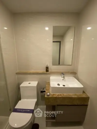 Modern bathroom with sleek fixtures and elegant marble countertop