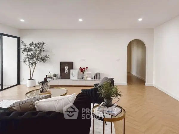 Spacious modern living room with elegant decor and cozy seating area.