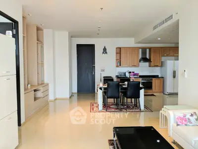 Spacious modern kitchen and dining area with sleek cabinetry and open layout.