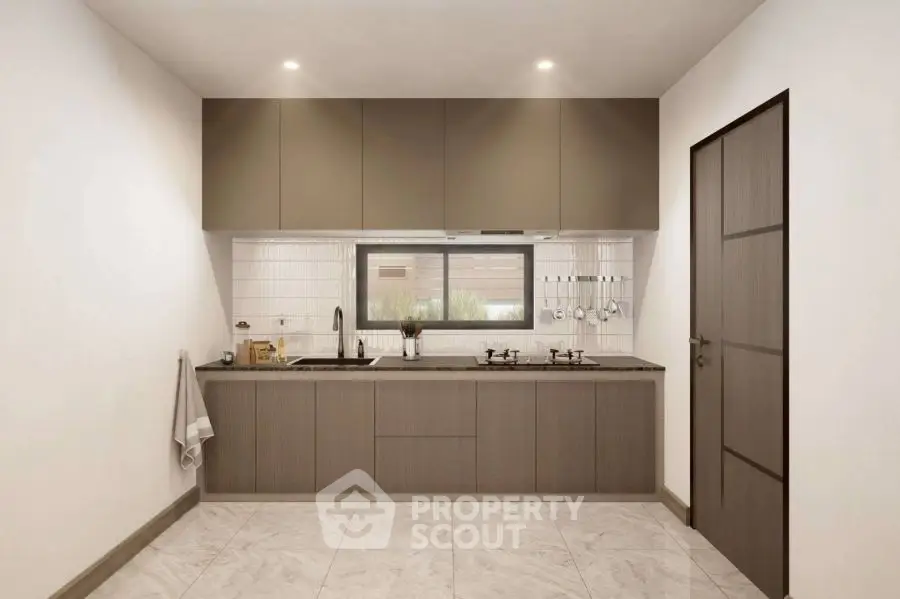 Modern kitchen with sleek cabinetry and gas stove