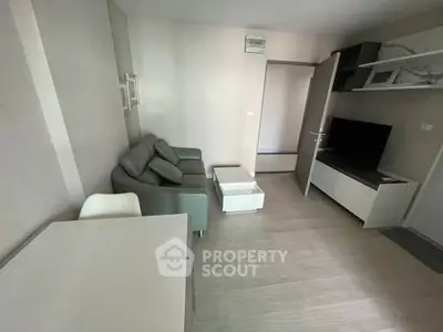 Modern living room with sleek furniture and neutral tones, ideal for urban living.