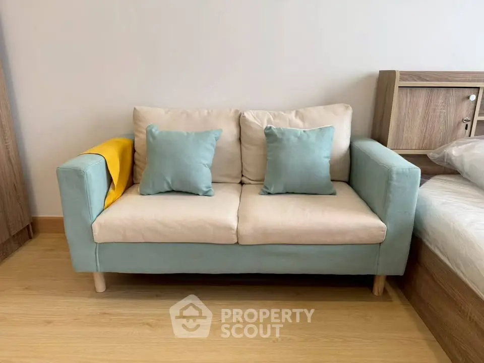 Cozy living room with stylish two-seater sofa and modern decor
