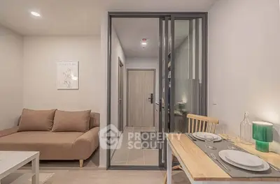 Modern living room with cozy sofa and dining area in stylish apartment.