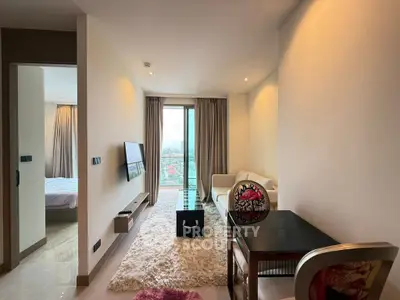 Modern living room with city view, featuring sleek furniture and elegant decor.