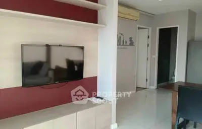Modern living room with wall-mounted TV and stylish decor
