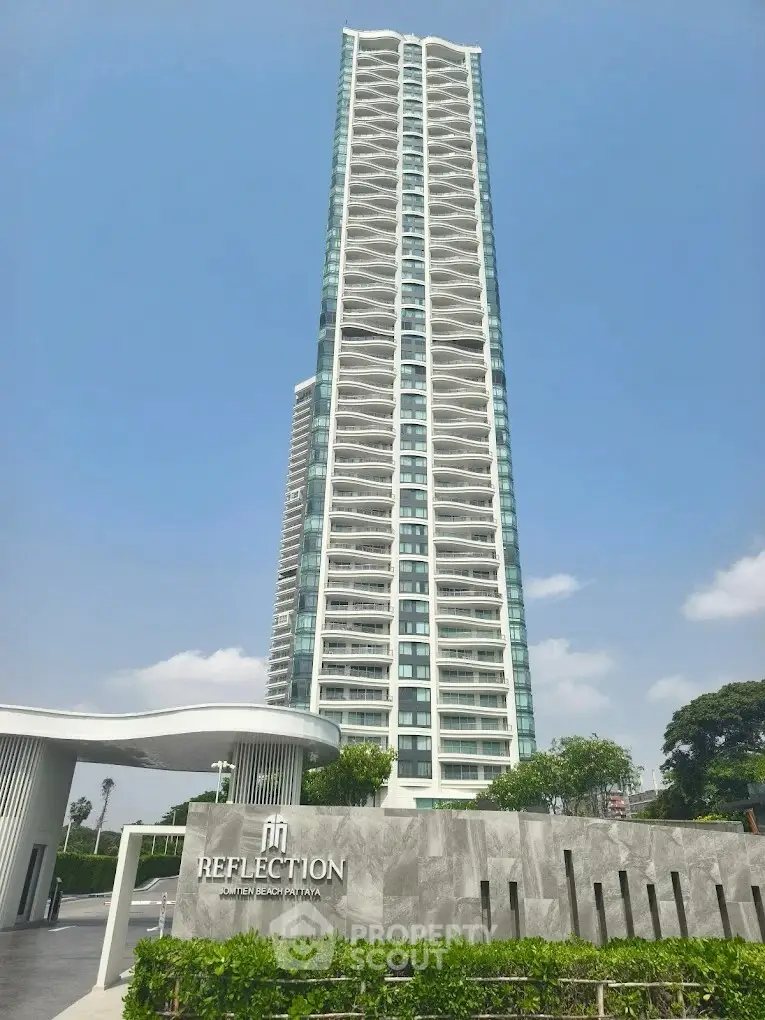 Luxurious high-rise building with modern architecture in Pattaya, offering stunning city views and premium amenities.