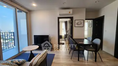 Modern living room with balcony view in high-rise apartment
