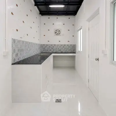 Modern minimalist kitchen with sleek countertops and stylish backsplash