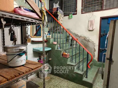 Charming vintage interior with staircase and rustic decor, perfect for renovation enthusiasts.