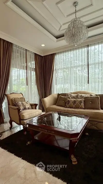 Luxurious living room with elegant chandelier and classic furniture