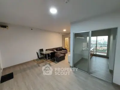 Spacious modern living room with dining area and balcony view