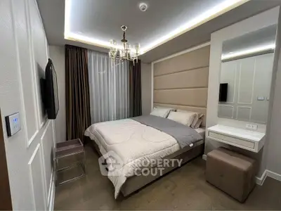 Modern bedroom with elegant chandelier and cozy decor
