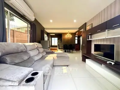 Spacious modern living room with plush sectional sofa and entertainment center