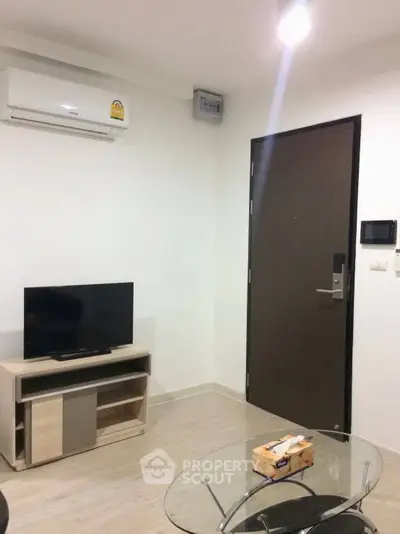 Modern living room with air conditioning and sleek furniture in a cozy apartment.