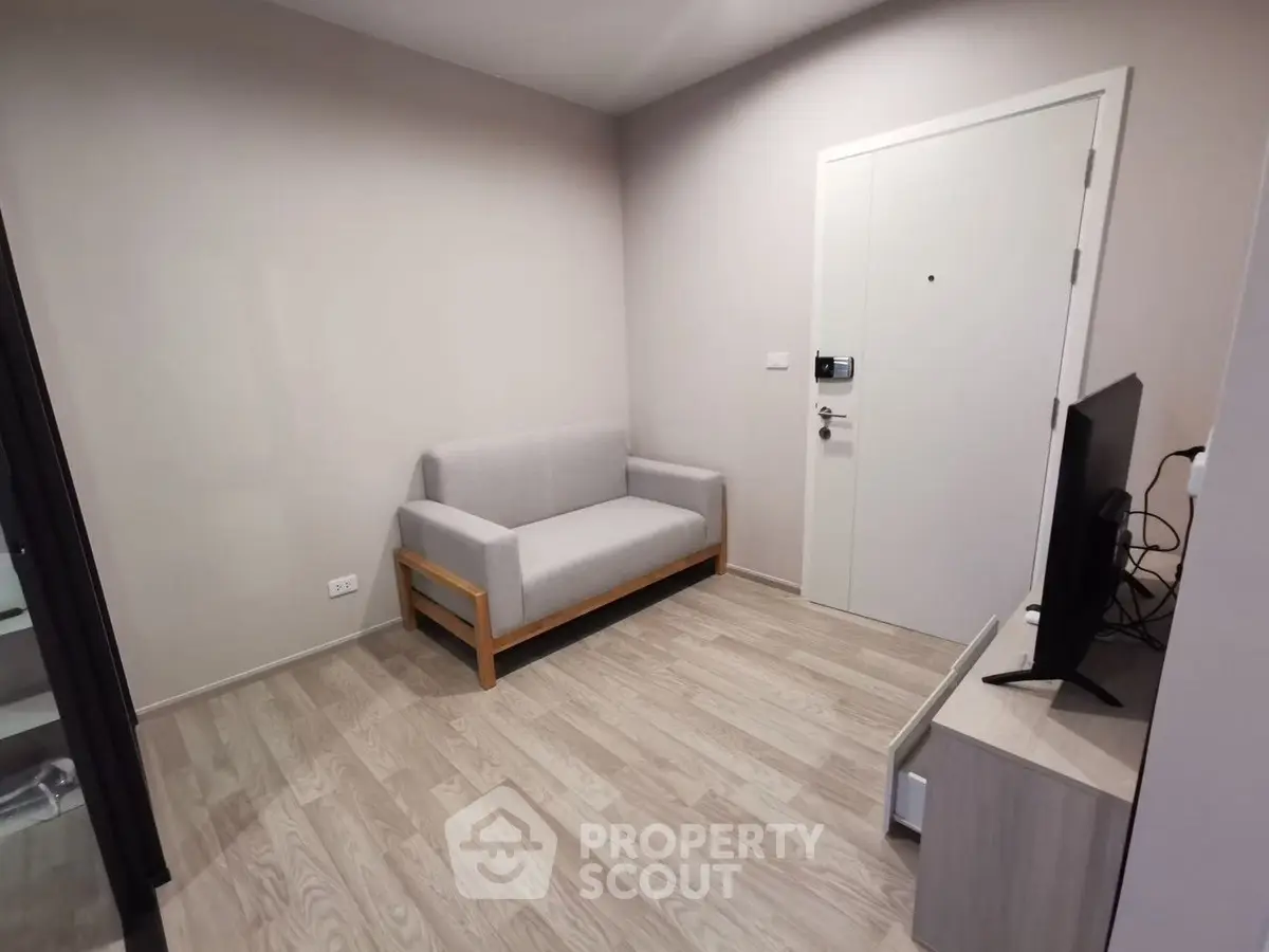 Cozy minimalist living room with modern sofa and TV setup