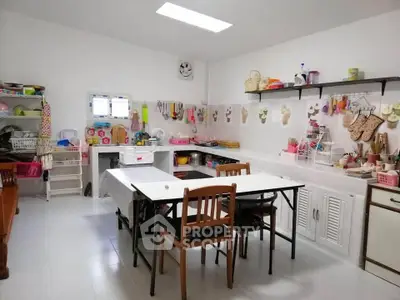 Charming kitchen with open layout and cozy dining area, perfect for family gatherings.