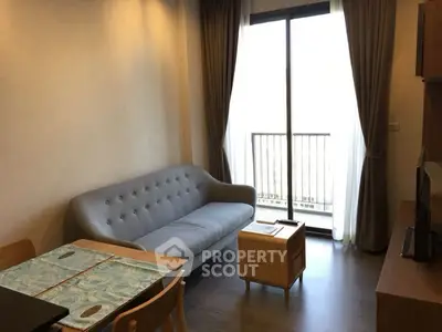 Cozy living room with modern sofa and balcony view