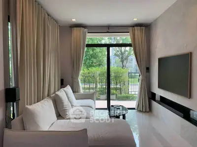 Modern living room with large windows and elegant decor