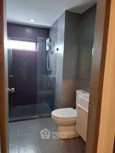 Modern bathroom with glass shower and sleek tile design