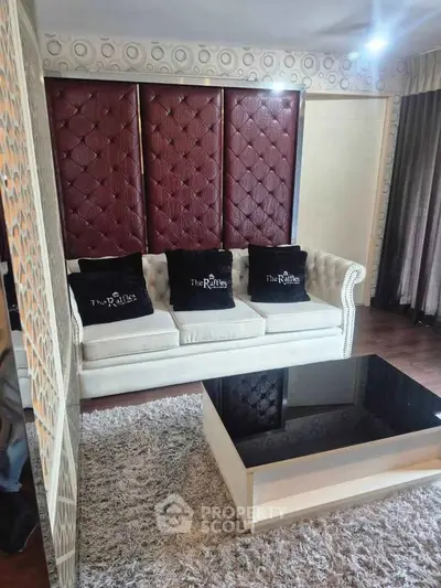 Luxurious living room with elegant sofa and modern coffee table in stylish apartment.