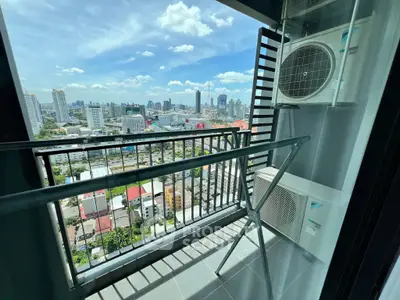Stunning city view from high-rise balcony with air conditioning unit.