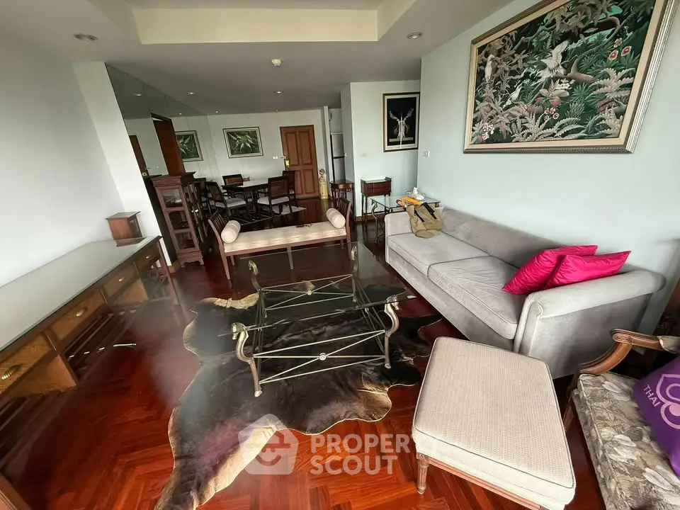 Spacious living room with elegant decor and hardwood floors in a modern apartment.