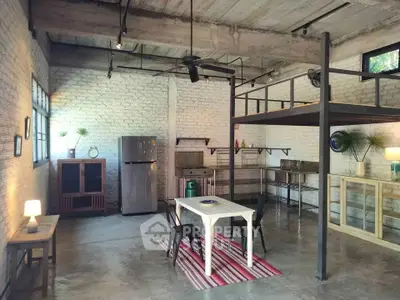Spacious industrial-style loft with high ceilings and modern furnishings.