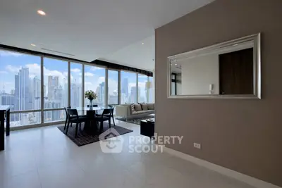 Luxurious high-rise living room with stunning city skyline views and elegant modern decor.