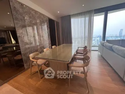 Luxurious dining area with panoramic city view and elegant wooden flooring.