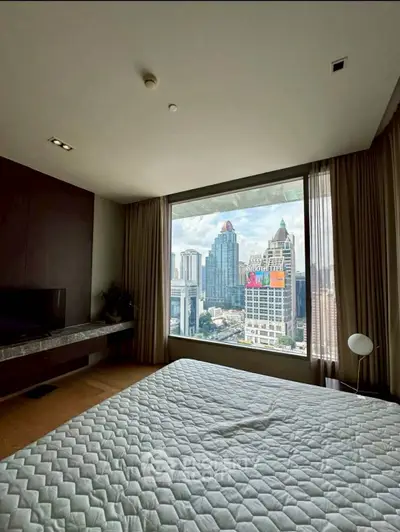 Luxurious bedroom with stunning city view through large window