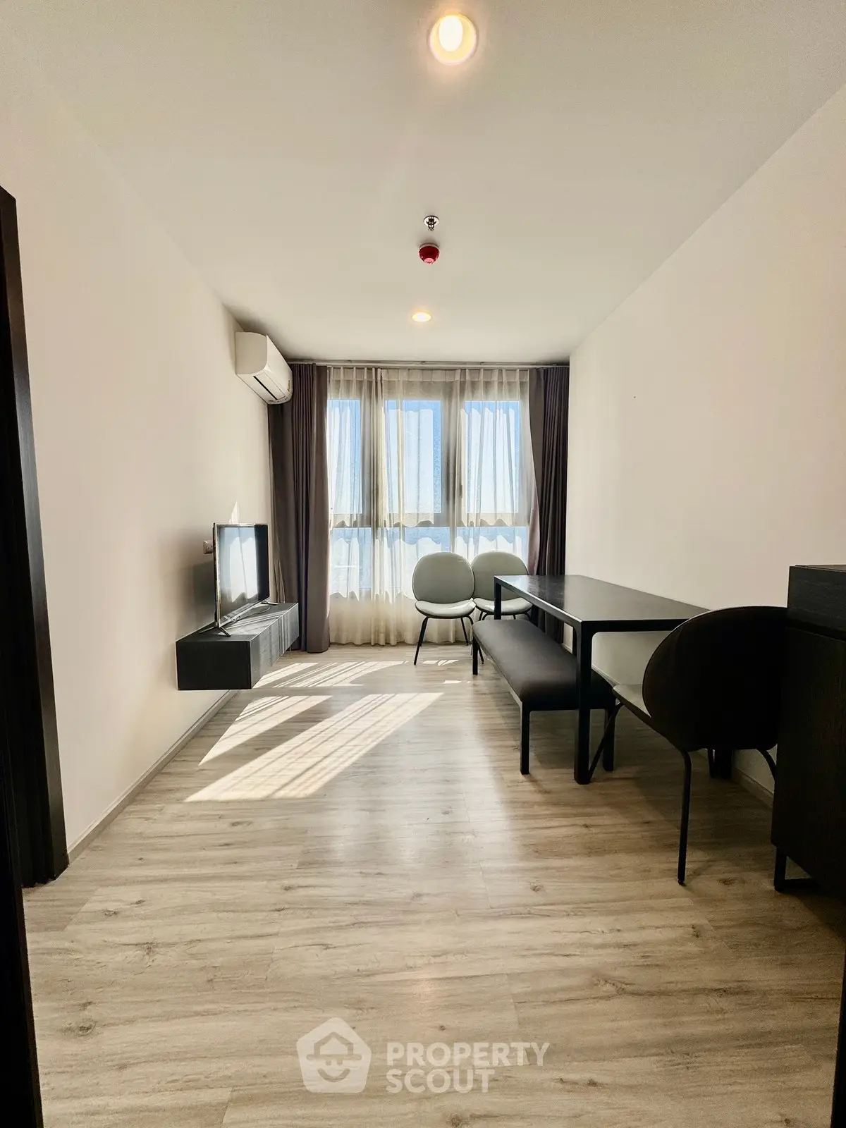 Modern living room with sleek furniture and natural light