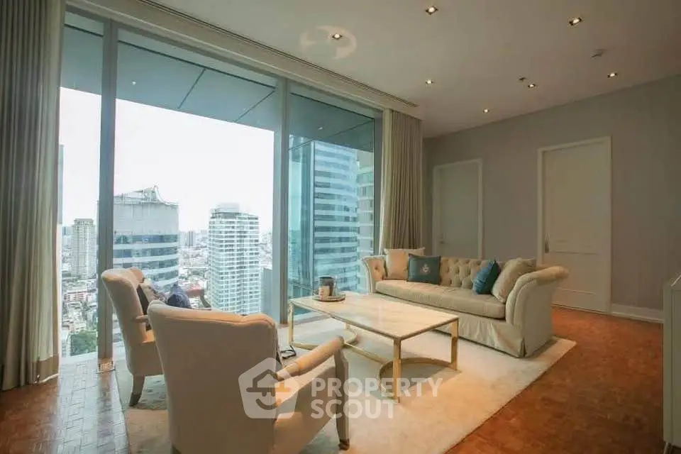 Luxurious high-rise living room with stunning city view and elegant furnishings.
