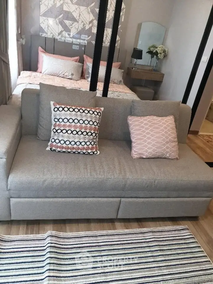 Stylish studio apartment with cozy living area and modern decor