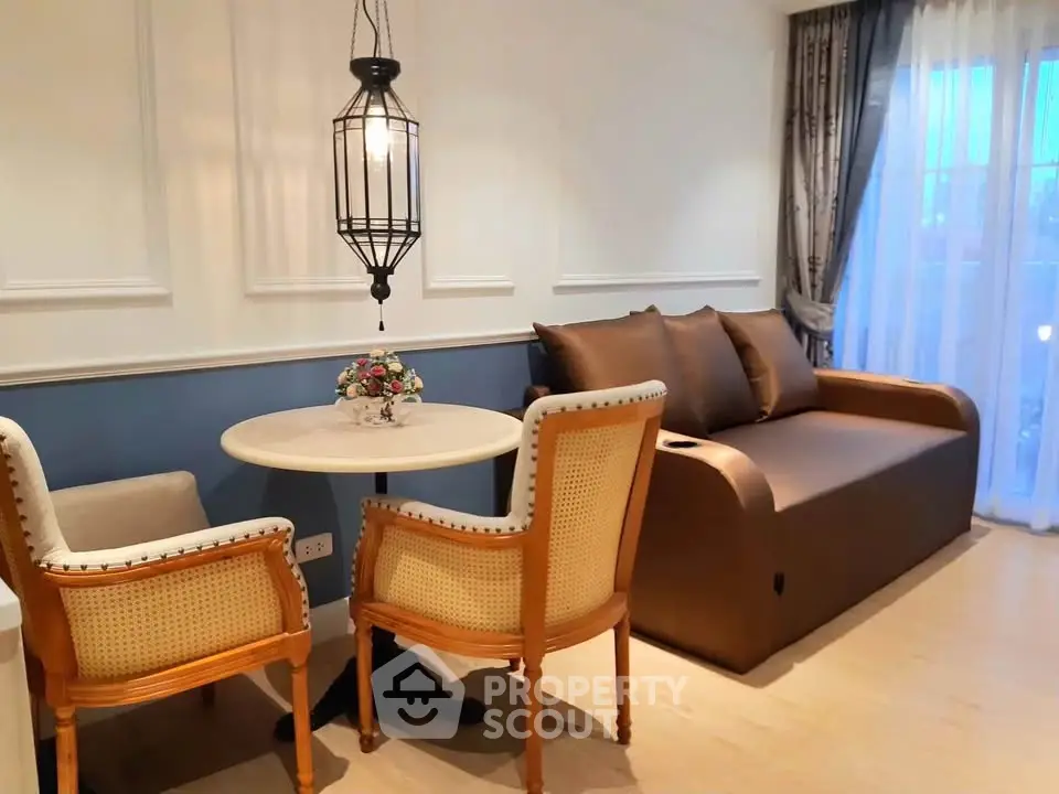 Charming living room with elegant seating and ambient lighting, perfect for relaxation and entertaining.