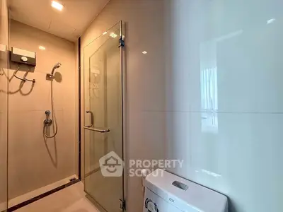 Modern bathroom with glass shower enclosure and sleek design