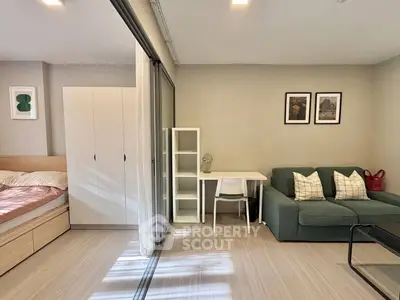 Modern studio apartment with cozy living area and stylish decor