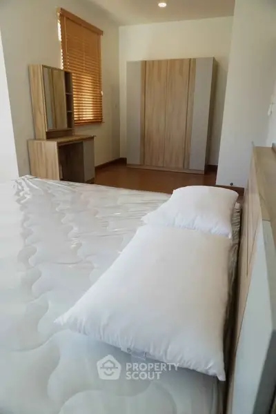 Modern bedroom with wooden furniture and natural light