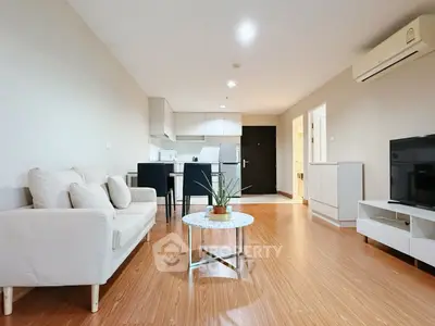 Spacious modern living room with open kitchen and stylish decor