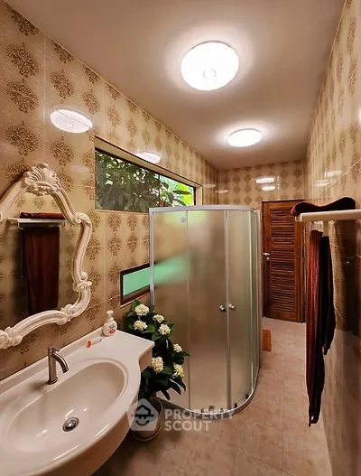 Charming vintage bathroom with elegant mirror and modern shower enclosure