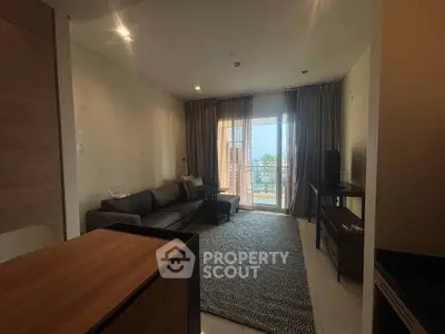 Modern living room with cozy sofa and balcony view