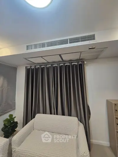 Modern living room with stylish curtains and cozy seating area