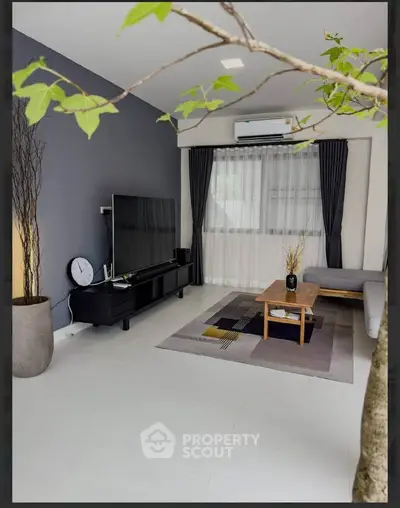 Modern living room with sleek TV setup and stylish decor