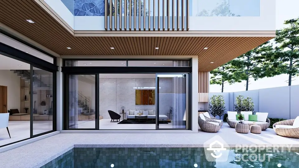 Luxurious modern home with pool and stylish outdoor seating area.