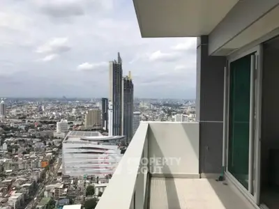Stunning high-rise balcony with panoramic city views, perfect for urban living enthusiasts.