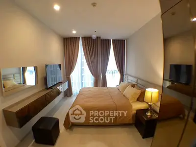 Luxurious bedroom with modern decor, large windows, and elegant lighting in a high-end apartment.